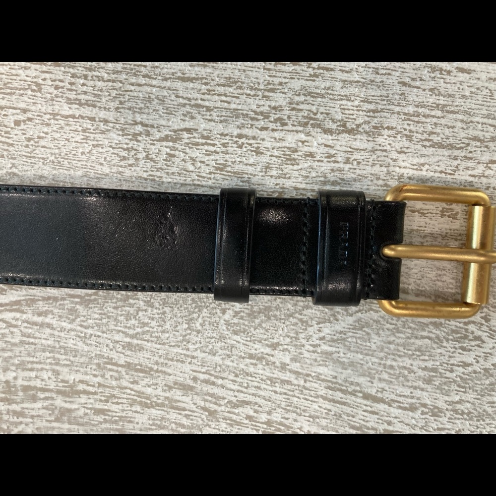 Men’s prada black belt never worn. Sat in closet.